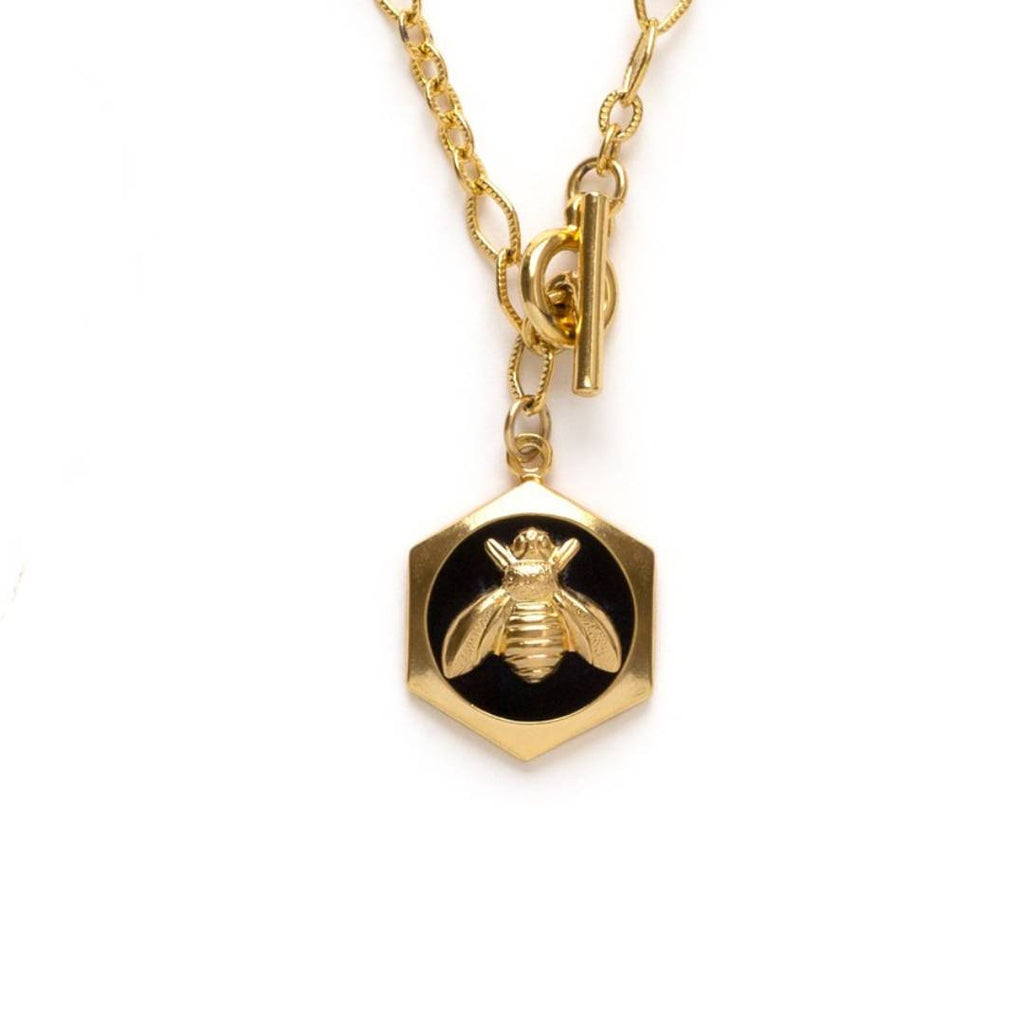Queen bee hexagon charm with black enamel on a 20" chain with front toggle clasp