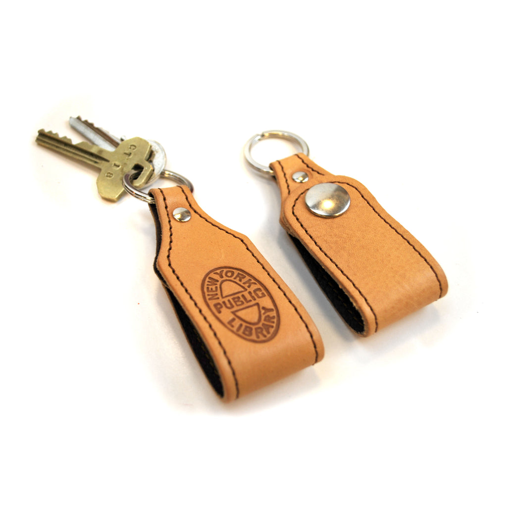 NYPL Bookbinding Stamp Key Chain - The New York Public Library Shop